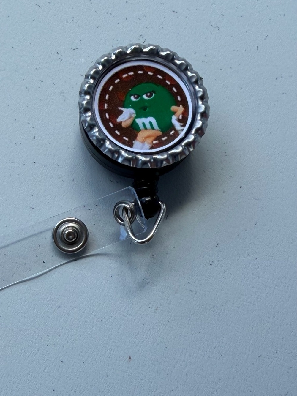 Retractable Badge Reel with Green Character Accent